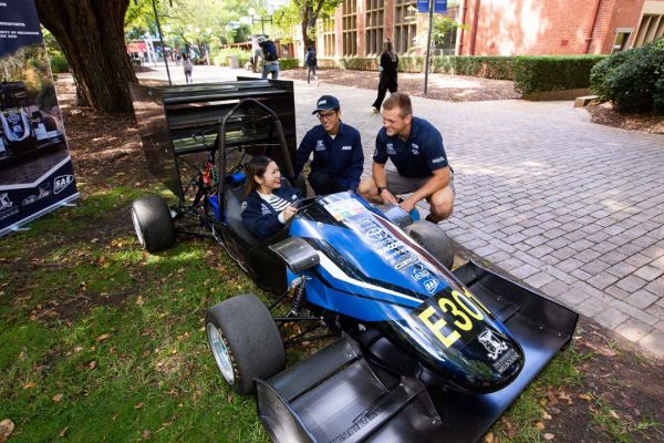 Students are looking at the Melbourne Uni motorsports club race car