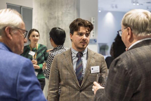 Student in suit at event