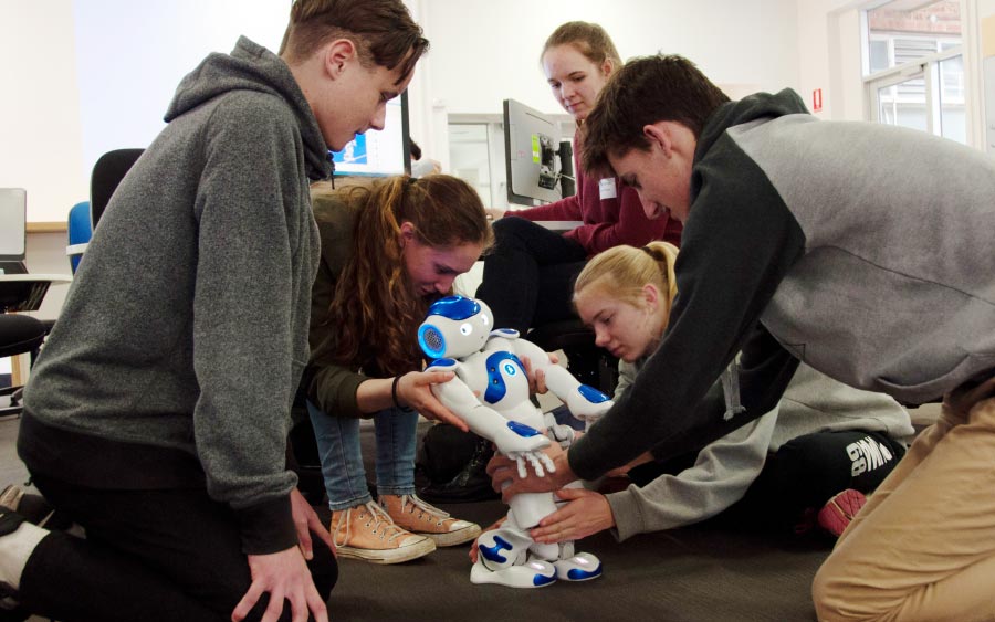 Students participate in the Hands on Engineering robotics workshop.