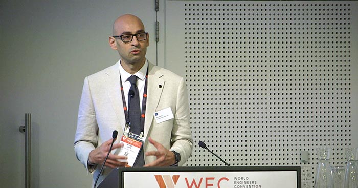 Dr Soheil Sabri presenting at podium at WEC Breakfast