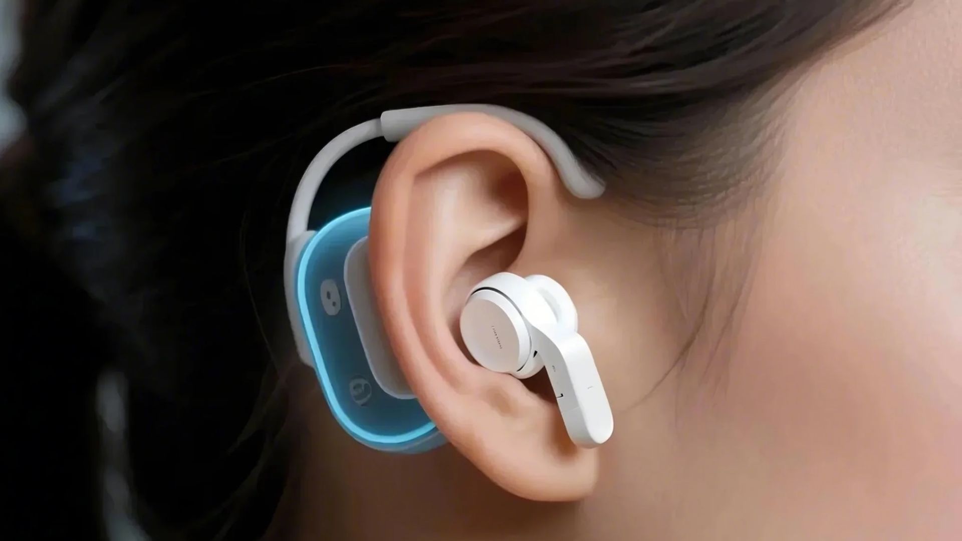 An earable attached to a woman's ear