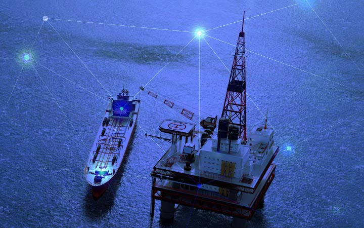 An oil tanker beside an ocean oil rig