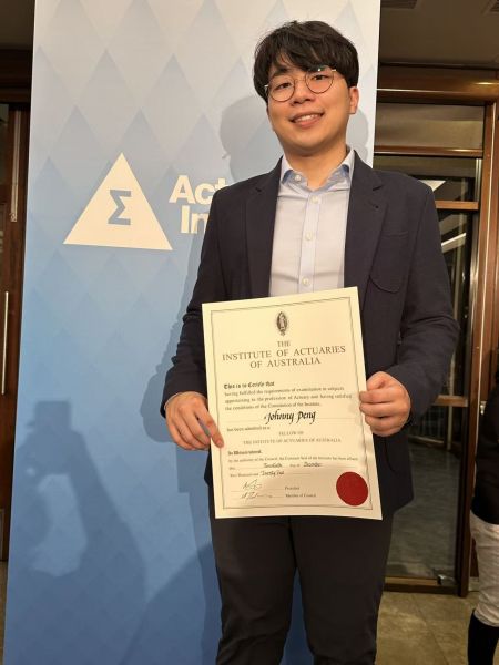 Johnny Peng Male student receiving award