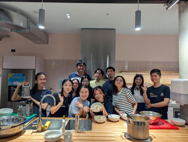 Dumpling making workshop group smiling