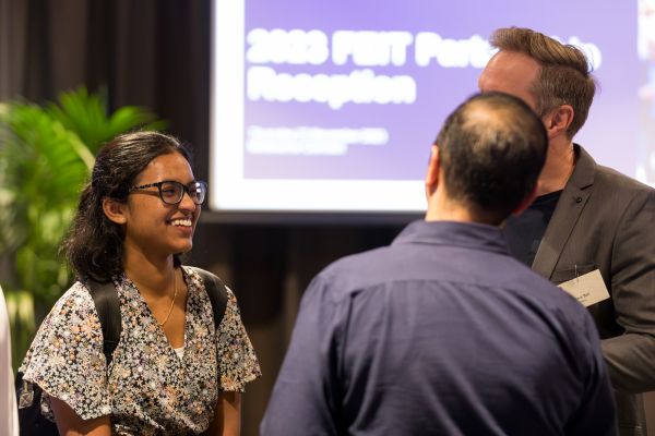 Scholarship recipient Selini mingles with Telstra staff during a FEIT Partnership Reception