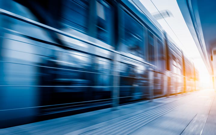 Motion blurred train pulling into a station