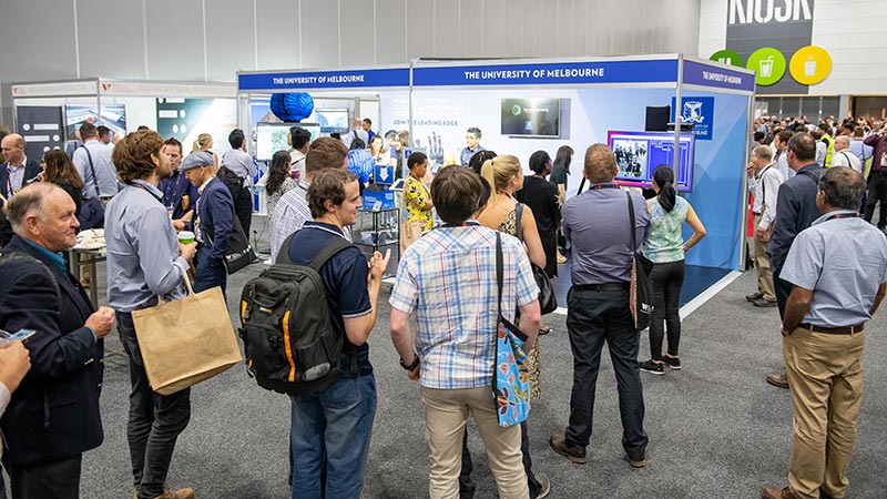 A crowd at the University of Melbourne stand at World Engineers Convention