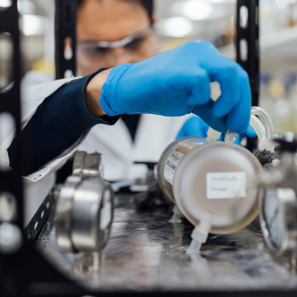 A person in PPE in a lab