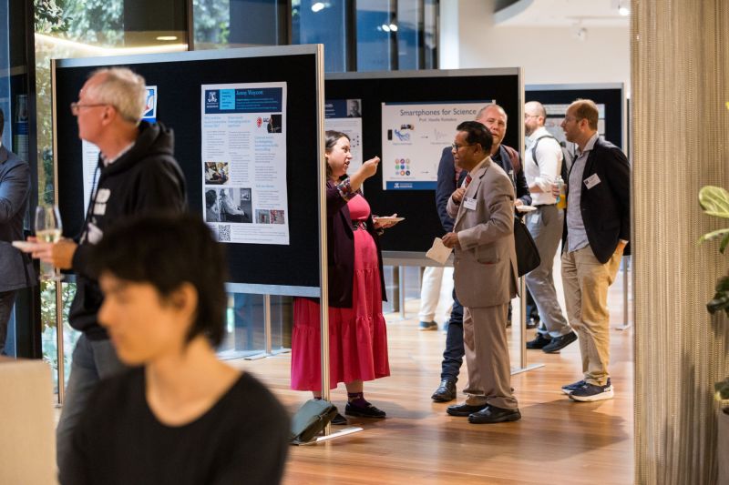 People looking at different poster displays of research.