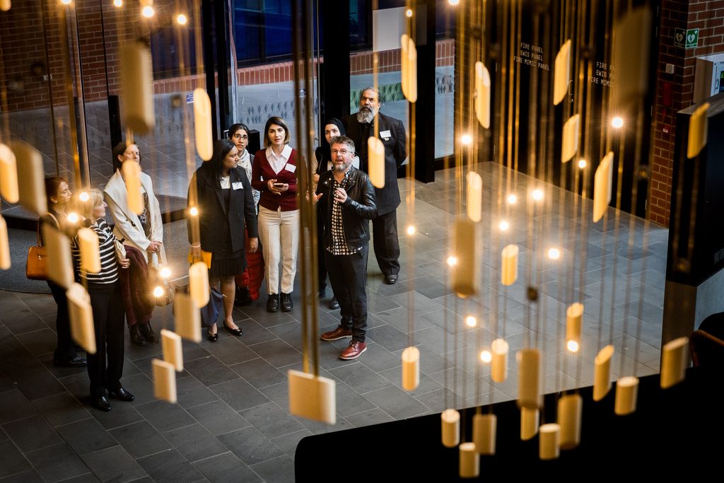 Group looking at The Heart, with artist Robert Walton