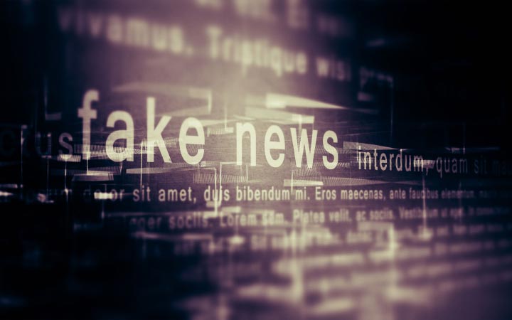 A jumble of letters and words, with 'Fake news' appearing in the centre.