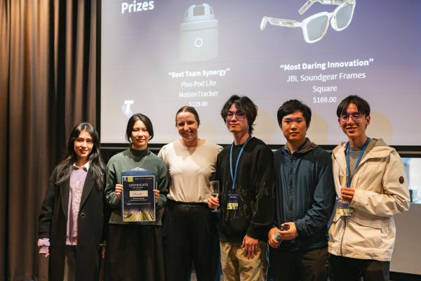 Students receiving their Telstra award at the 2024 FEIT Hackathon.